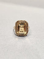 9c Yellow Gold Ring with Emerald Cut with gold etching border 
