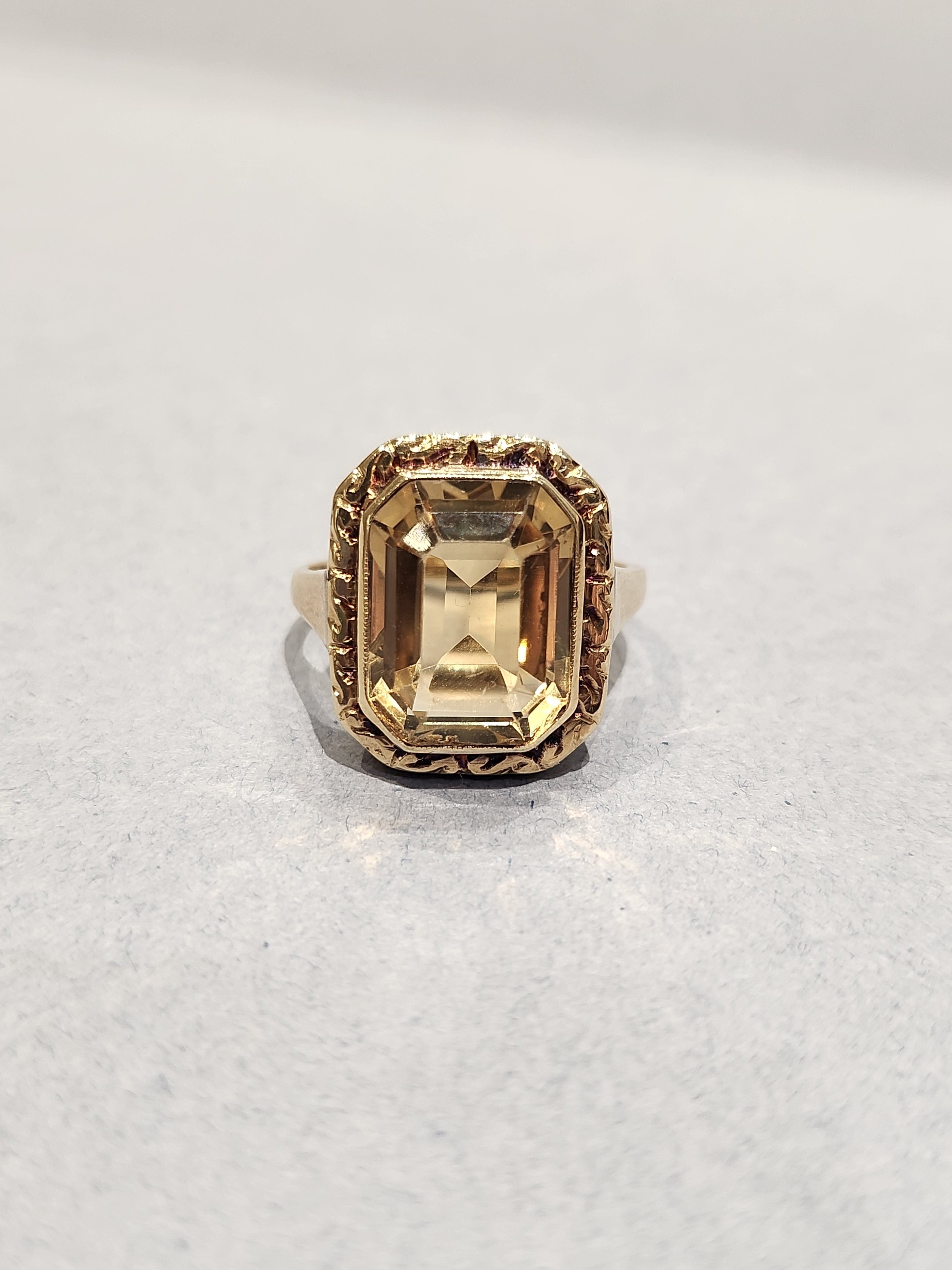 9c Yellow Gold Ring with Emerald Cut with gold etching border 